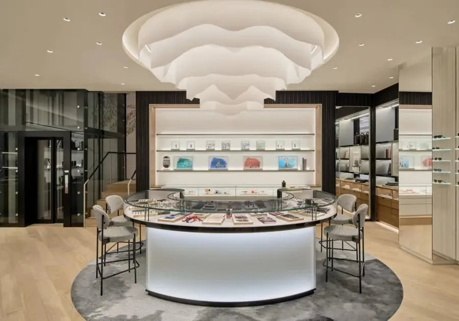Sculptural paper chandelier above a curved display counter in the Montblanc boutique on George Street in Sydney
