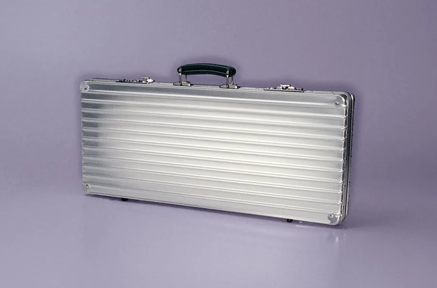 The closed RIMOWA × Faber-Castell Artist Case in grooved anodised aluminium with a leather handle